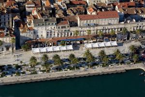 an aerial view of a city with palm trees and buildings at Apartment 4 You in Split in Split