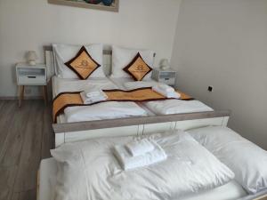 Letto o letti in una camera di Pension VIDHOUS 1