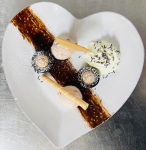a plate of food in the shape of a heart at Hotel Krone in Königsbrunn