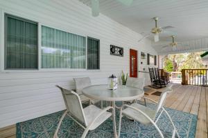 a dining room with a table and chairs on a porch at Homosassa Home with Pool Access - By Boat Launch in Homosassa