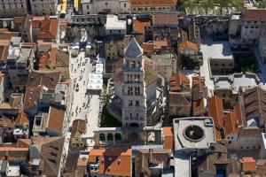 an aerial view of a city with a tall building at Apartment 4 You in Split in Split