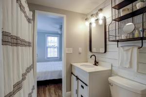 a white bathroom with a sink and a mirror at Pura Vida - B -Murrells Inlet in Myrtle Beach