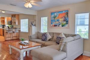 a living room with a couch and a table at Longboard in Holmes Beach +28 photos
