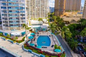 an aerial view of a swimming pool at a resort at Marina Views Studio - Ilikai, 941 in Honolulu