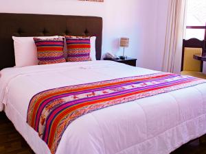 Cama ou camas em um quarto em Hotel Santa Maria