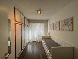 a room with a bed and a window at Villetta/5Rent in Muzzano