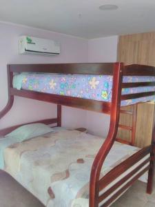 two bunk beds in a small room with at Dep. Salinas, Chipipe. in Salinas