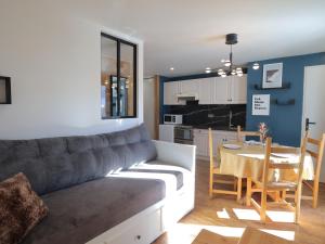 a living room with a couch and a table at Appartement Les Gets, 2 pièces, 4 personnes - FR-1-623-304 in Les Gets