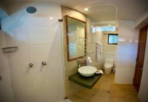 a bathroom with a sink and a toilet at Inkantari Boutique Hotel in Cusco