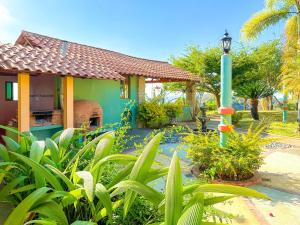 a house with a street light in a garden at Cerrito Encantado! Hidden Escape with Amazing Views 