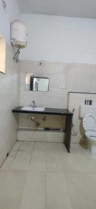 a bathroom with a sink and a toilet at OYO Flagship 81322 Laxmi Palace in Rourkela