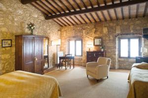 a bedroom with two beds and a table and chairs at I Costanti in Caldiero +38 photos