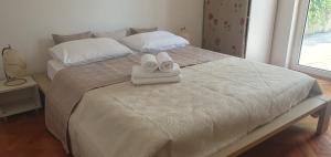 Posteľ alebo postele v izbe v ubytovaní Apartments Stari Pavle