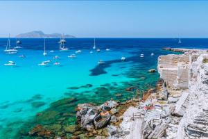a view of a harbor with boats in the water at casa vacanza zu ciano in Marausa