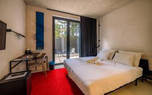 a bedroom with a white bed and a window at Moro Inn in Korčula +37 photos