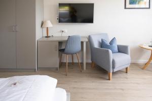 TV a/nebo společenská místnost v ubytování Gästehaus Kölfhamm 2
