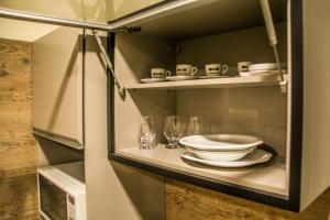 Kuchyň nebo kuchyňský kout v ubytování Blu Apart Hotel