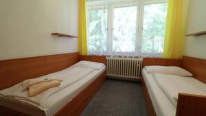 Posteľ alebo postele v izbe v ubytovaní Horský Hotel Neptun