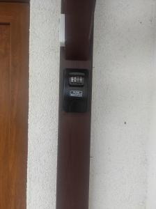 a parking meter on the side of a building at Haus Kraus in Bayerisch Eisenstein