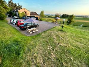 a group of cars parked in a parking lot at Southpark House in Dumfries