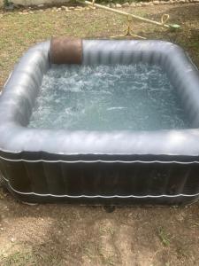 a large pool of water in a yard at Chez Zabou in Carpentras +2 photos