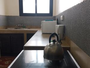 Kuchyň nebo kuchyňský kout v ubytování Kakatar Family Residence , Yoff