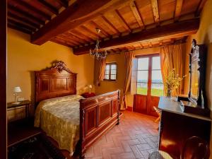 A bed or beds in a room at Agriturismo Cima alla Serra