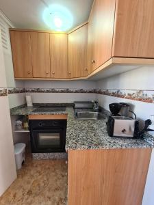 Kuchyň nebo kuchyňský kout v ubytování Apartamento Playmon Park 16 IF Benidorm
