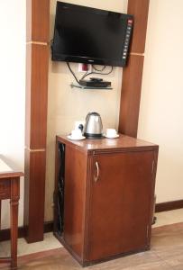 TV a/nebo společenská místnost v ubytování HOTEL METRO REGENCY