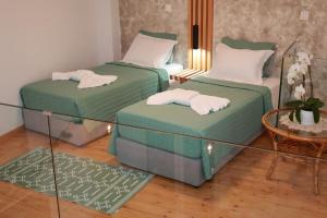 Ένα ή περισσότερα κρεβάτια σε δωμάτιο στο Cane’s Family Guest House
