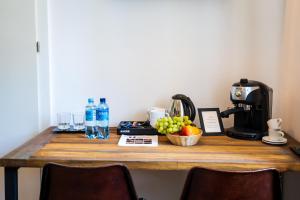 a table with a coffee maker and fruit on it at Sokowirówka in Poniatowa