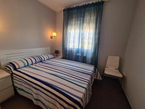 Łóżko lub łóżka w pokoju w obiekcie Atico Barcelona IF Benidorm
