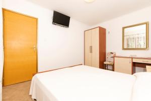 Postel nebo postele na pokoji v ubytování Apartments Dominik