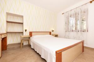 Postel nebo postele na pokoji v ubytování Apartments Dominik