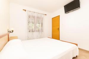 TV a/nebo společenská místnost v ubytování Apartments Dominik