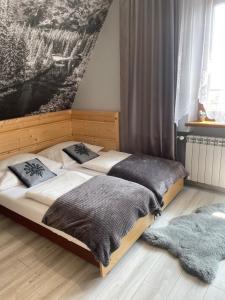 Łóżko lub łóżka w pokoju w obiekcie Zakopianskie Pokoje u Eweliny