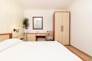 Postel nebo postele na pokoji v ubytování Apartments Dominik