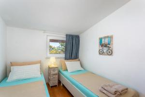 Postel nebo postele na pokoji v ubytování Apartments Tamaris