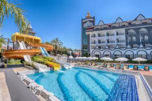 a pool at a resort with a water slide at WELL PALACE SIDE in Side