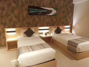 Letto o letti in una camera di Click Hotel Bangalore - International Airport