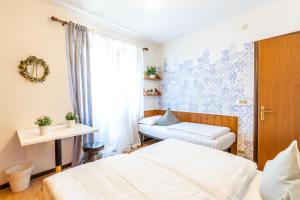 Postel nebo postele na pokoji v ubytování Sleep In Venzone
