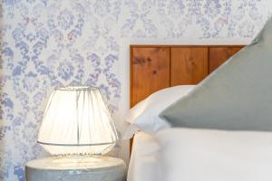 Postel nebo postele na pokoji v ubytování Sleep In Venzone