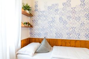 Postel nebo postele na pokoji v ubytování Sleep In Venzone