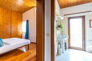 Postel nebo postele na pokoji v ubytování Sleep In Venzone