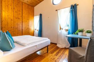Postel nebo postele na pokoji v ubytování Sleep In Venzone