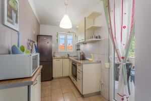 Kuchyň nebo kuchyňský kout v ubytování Apartments Tamaris