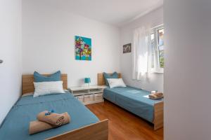 Postel nebo postele na pokoji v ubytování Apartments Tamaris