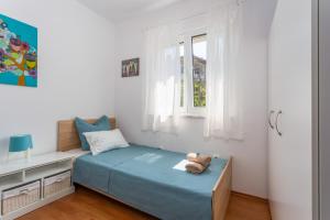Postel nebo postele na pokoji v ubytování Apartments Tamaris