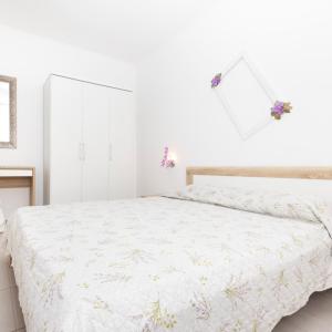 Postel nebo postele na pokoji v ubytování Apartments Dominik
