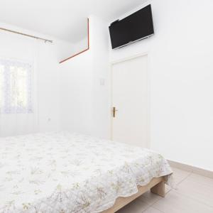 Postel nebo postele na pokoji v ubytování Apartments Dominik